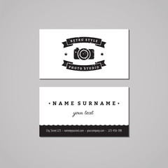 Photo studio business card design concept. Photo studio logo with photo camera, stars and ribbon. Vintage, hipster and retro style. Black and white.