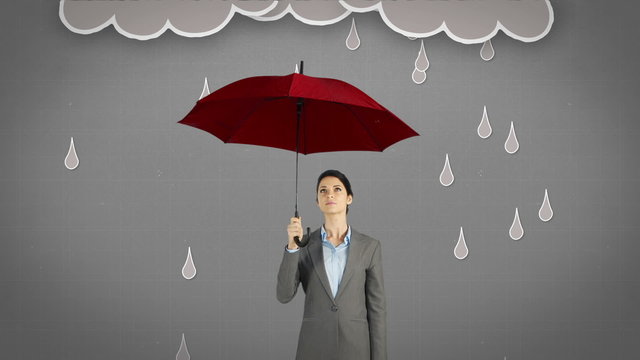 Composite image of businesswoman holding an umbrella