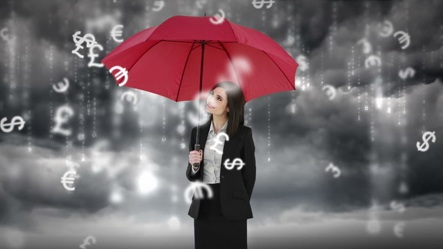 Composite image of businesswoman holding an umbrella