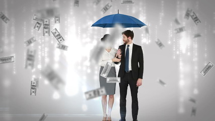 Business people standing under umbrella - Powered by Adobe