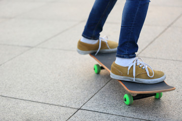 skateboarding legs riding on a skateboard