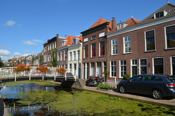 Fototapeta na wymiar Bridge over channel in Dutch city of Delft