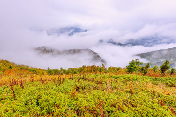 Clouds above and between the mountains.