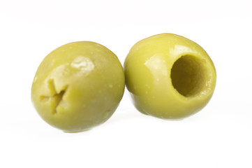 Pitted green olives close up on the white