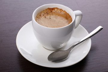 Cup of coffee on table close up