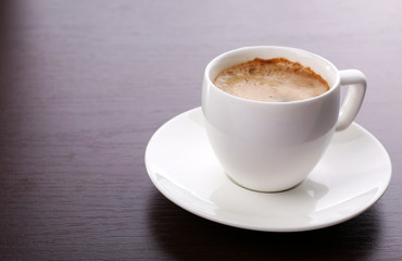 Cup of coffee on table close up