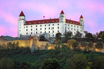 Fototapeta na wymiar Bratislava Castle on the background of the pink clouds at sunset, Slovakia