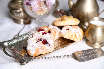 Antique tea-set with Turkish delight and baking on table close-up
