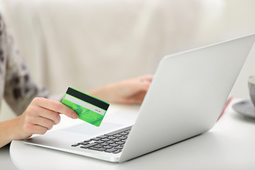 Female making online payment, close up