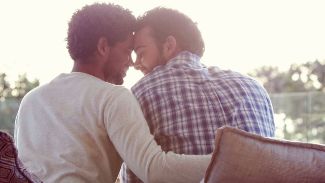 Homosexual couple hugging outdoor