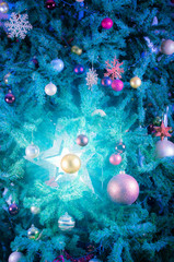 Glowing blue star decoration on Christmas tree - Abstract