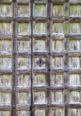 Old wooden door with rusty handles