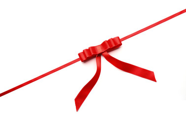 Shiny red ribbon with bow isolated on white