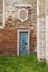 Blue door on red brick wall