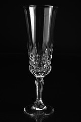 Empty champagne glass on black background