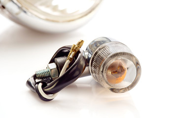 Turn signal/Turn signal of motorcycle on white background.