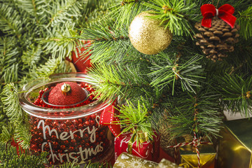 Christmas decoration with gifts and present boxes under a pine tree.
Golden harmony, warm atmosphere.