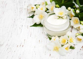 Fototapeta na wymiar face and body cream moisturizers with jasmine flowers