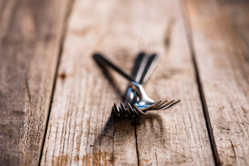 Forks on a old wooden table