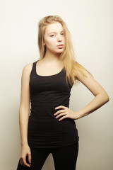 Naklejka premium Beautiful woman with long blond hair. Fashion model posing at st