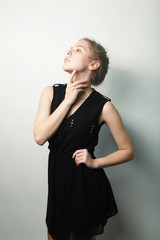 Fototapeta premium young fashion blond woman in black dress 