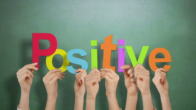 Hands holding up positive