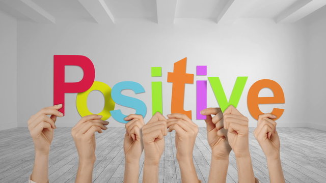 Hands holding up positive