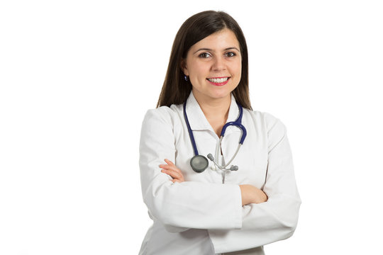 Portrait of young friendly beautiful female doctor with crossed arms and smiling