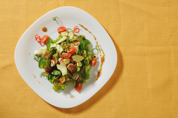gourmet salad on white plate