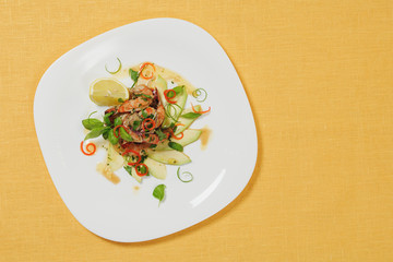 Seafood salade on white plate