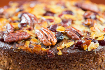 Pecan cake made with sliced almonds and dried cranberries 