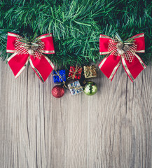 Fototapeta na wymiar christmas gift boxes and balls background on wooden texture