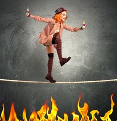 Clown balance on fire