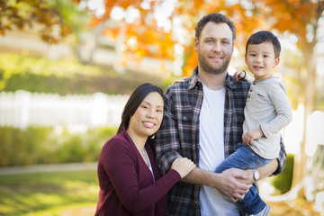 Fototapeta premium Mixed Race Young Family Portrait Outdoors