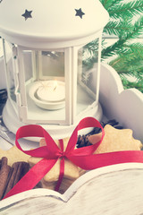 Candle Lantern, biscuits and Christmas decorations in wooden box