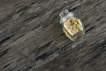 Butter cookie in glass bottle on wood background