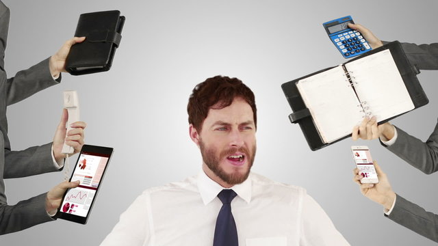 Stressed businessman with hands on head