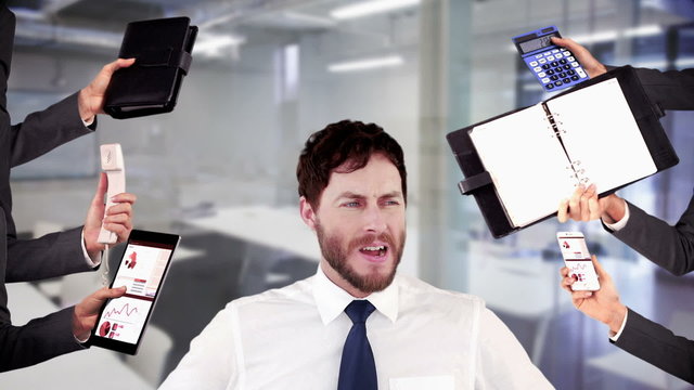 Stressed businessman with hands on head