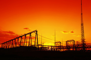 Fototapeta na wymiar The silhouette of high voltage substations