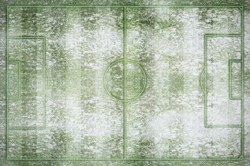 Green football stadium and field in winter snow