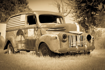 Old American van deserted rusting away