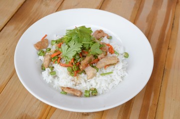 pork and vegetable fried on hot rice - Thailand healthy food