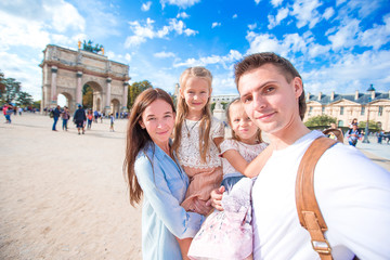 Obraz premium Happy family with two kids in Paris on french vacation