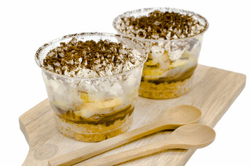 Banoffee pie in a cup on white background, Selective focus and Isolate image
