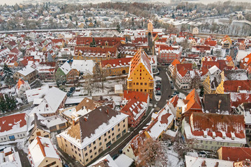 Winter panorama of medieval town within fortified wall. Top view from 