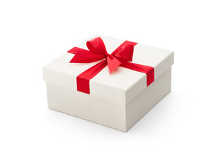 Fototapeta premium White gift box with red bow isolated on white background - Clipping path included