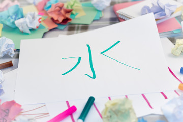 Mandarin; Kids Writing New Chinese Character for Practice