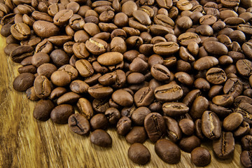 Coffee beans on vintage wooden board