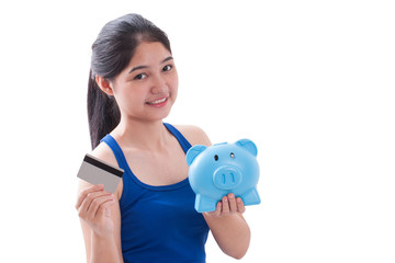 Fototapeta na wymiar Young woman holding piggy bank and card