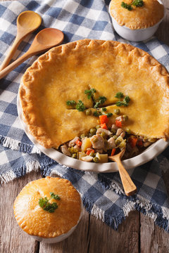 American pastries:  big Chicken pot pie on the table. vertical
